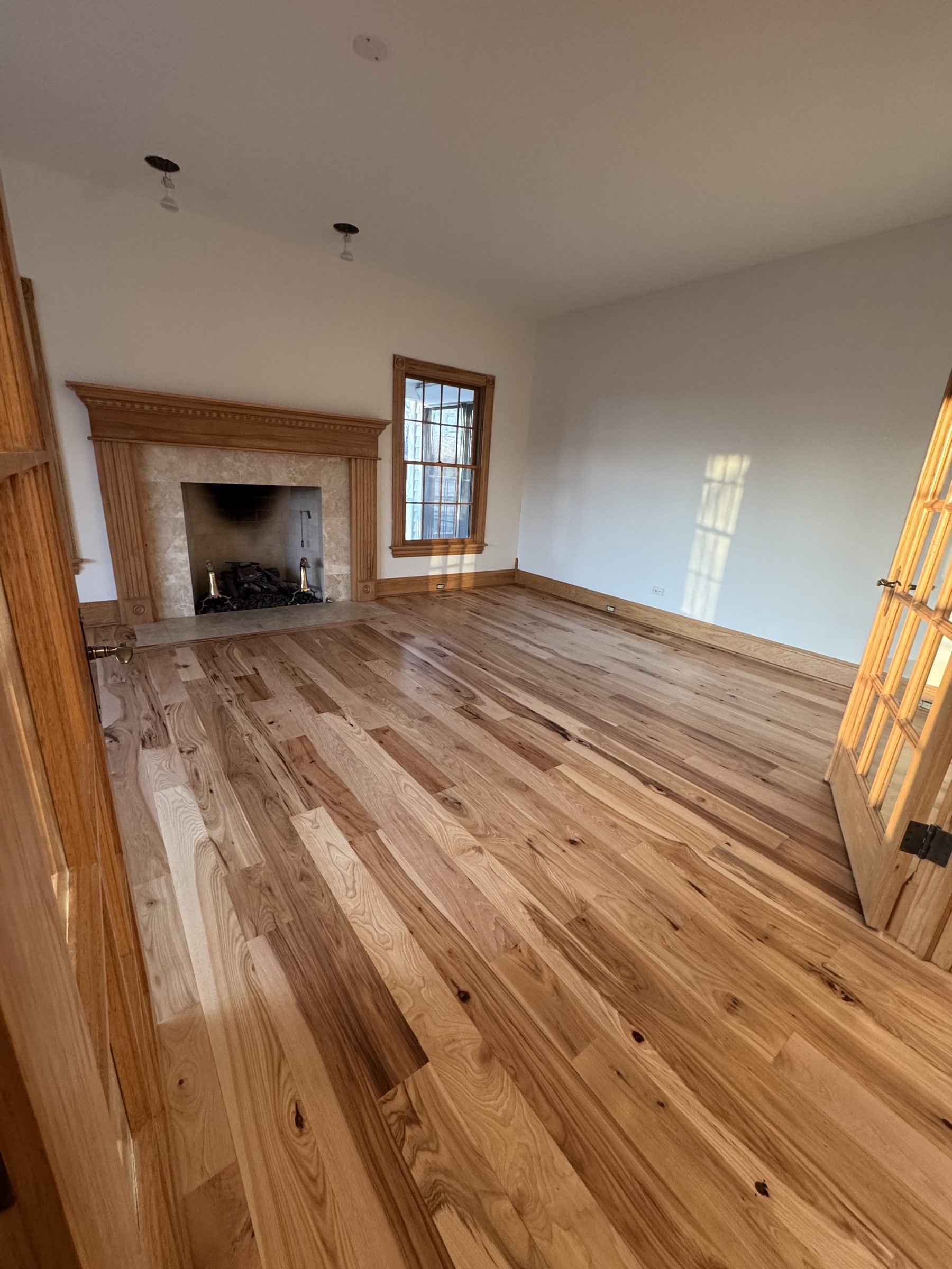 Formal room with fireplace and hickory floors